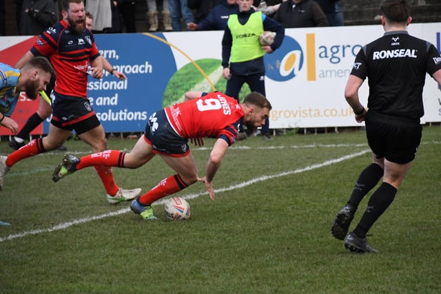 Connor Jones touches the ball down over the line for a Featherstone try.