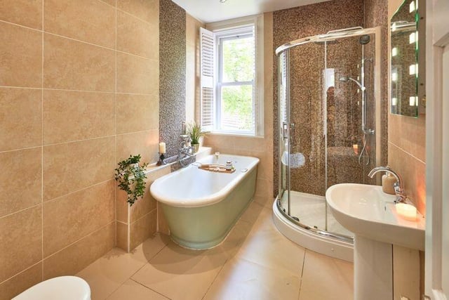 A stylish bathroom with the property's original 1930s bath intact.