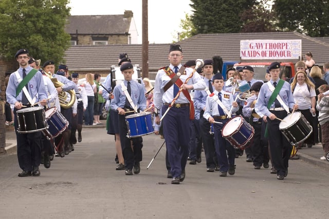 The marching band at the 2009 Gawthorpe Maypole Procession return to the village square.