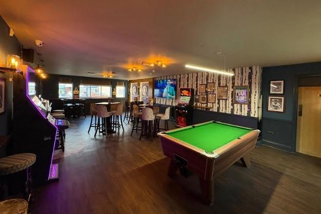 A pool table and two state of the art virtual darts boards in the games room for customers to enjoy.