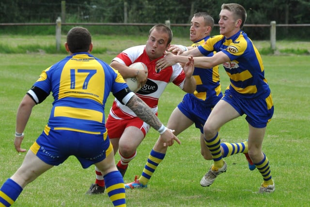 Fryston Warriors' Adam Dickinson tackled by Oulton players in the penultimate game of the 2012 season in the Yorkshire Men's League. Fryston won 76-0 and a week later were confirmed as Premier Division champions after a 68-0 win over Bradford Dudley Hill