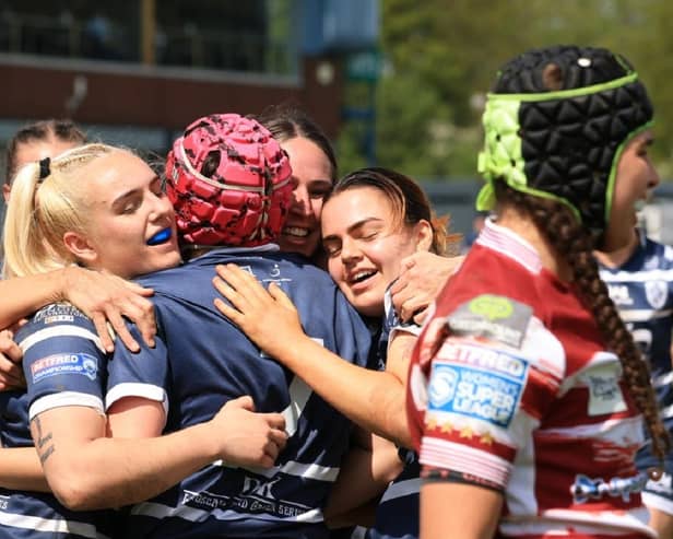Tally Bryer celebrates scoring her try against Wigan Warriors with Featherstone Rovers teammates. Picture: John Victor