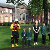 Helen Massey (centre) with pupils of Silcoates School and RNLI mascot, Stormy Stan.