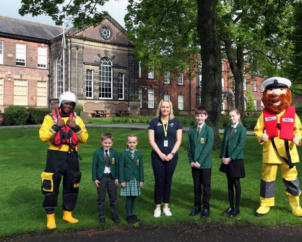 Helen Massey (centre) with pupils of Silcoates School and RNLI mascot, Stormy Stan.