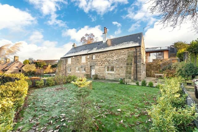 A view of The Cottage, that is situated between Sandal and Newmillerdam, across part of its lawned garden.
