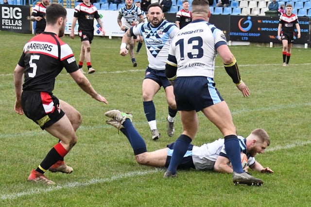 Kieran Hinchliffe dives over to open the scoring with the first try for Normanton Knights.