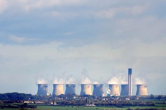 Steam rises from the eight cooling towers at the Ferrybridge power station near Pontefract in this picture taken in 2006. The coal fired power plant was the first 2000MW power station in Europe  and first supplied energy to the National Grid. The station had two 198m high chimneys and eight 115m high cooling towers, which were the largest of their kind in Europe. Photo by Paul ELLIS/AFP via Getty Images