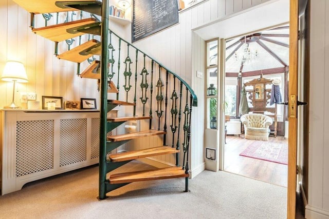 A spiral staircase to the first floor is another striking feature.
