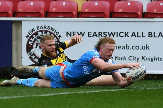 Lachlan Walmsley scores the first try of his hat-trick on his competitive debut for Wakefield Trinity against York Knights. Picture: Jonathan Gawthorpe
