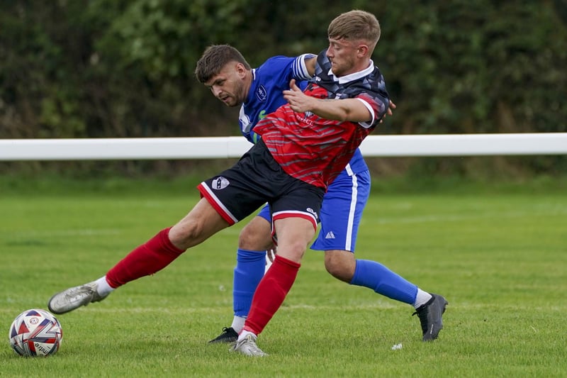 Sam Awty battles for the ball for Horbury Town.