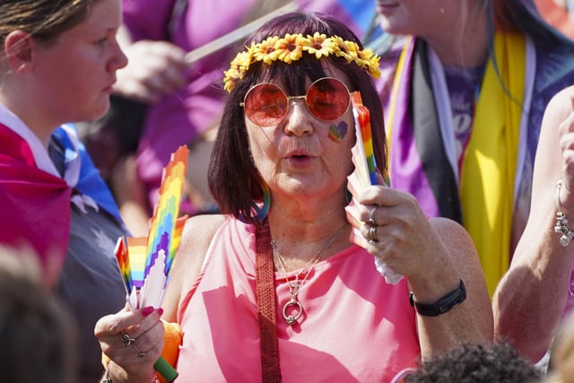 People often adorn flower crowns, face paint and other festival garb during Pride.