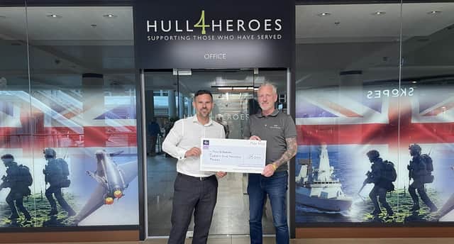 Wakefield's Navigation Wealth’s CEO Matt Hammond presenting a cheque for £25,000 to Paul Matson, founder of Hull 4 Heroes.