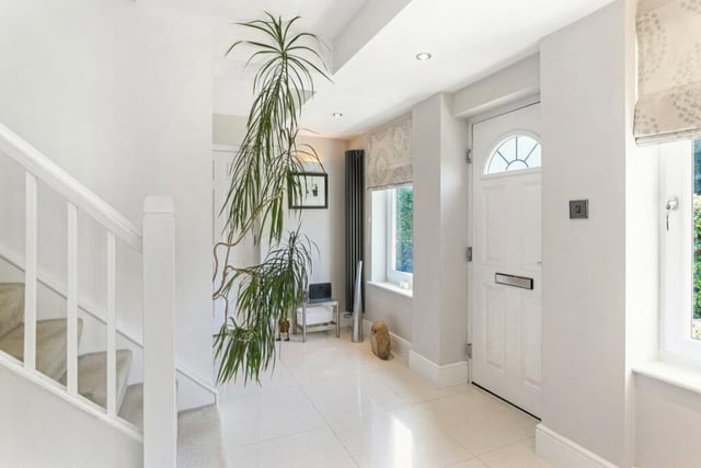 As you enter the property, this stunning hallway features a high gloss tiled floor, double glazed window, two feature radiators, a useful understairs cupboard, downlighting to the ceiling and an access door to the integral garage.