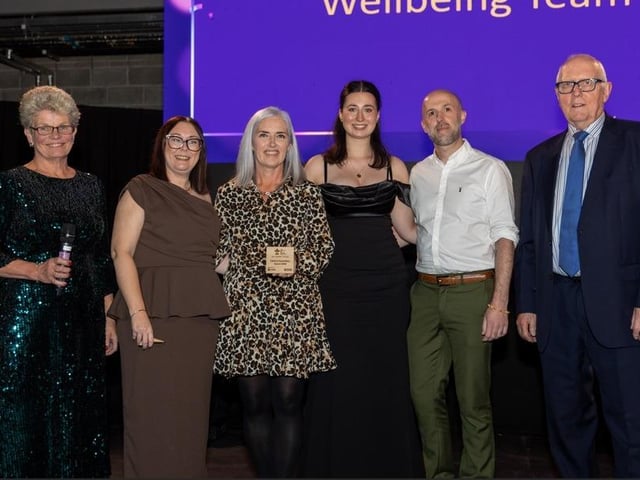 The hospice Wellbeing Team with their award.