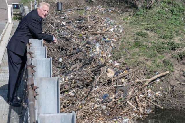 Paul Dainton, president of Residents Against Toxic Scheme (RATS), pictured in 2019 with plastic waste piled up at Stanley Ferry. He said the waste had floated down from Welbeck tip