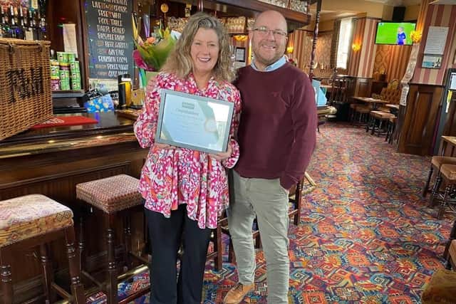 Michelle Dwan is retiring after 32 years at the Victoria Hotel, pictured with Andy Longley from Admiral Taverns.