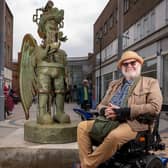 Artist Jason Wilsher-Mills pictured with his 'Amazon love God' statue