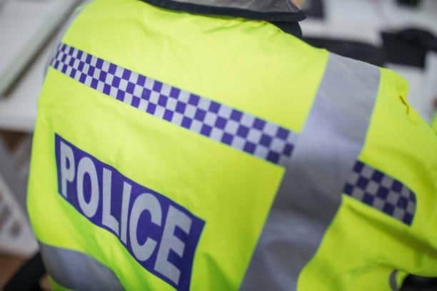 A woman has been arrested as enquiries continue into the attempted murder of three children in Huddersfield.