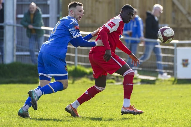 Pontefract Collieries' Connor Smyth  keeps close tabs on a Winterton Rangers player.