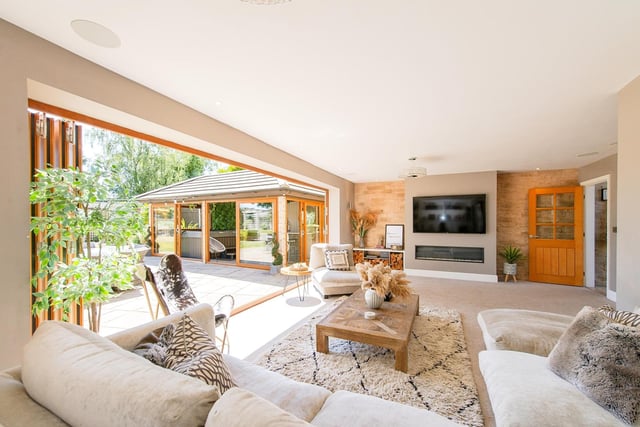 Bi-fold doors open to the rear garden from the spacious lounge.