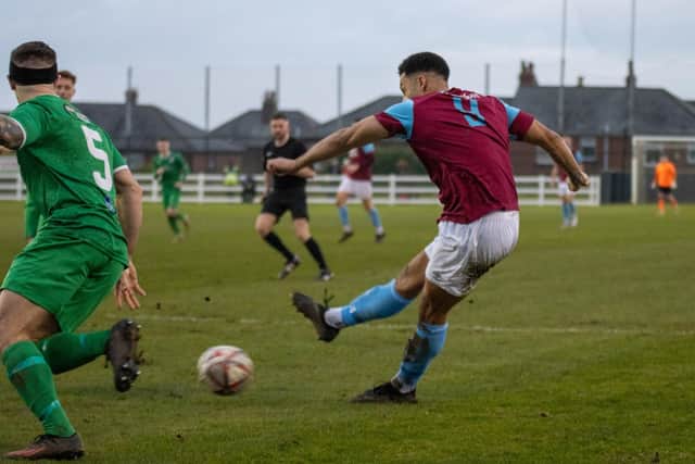 Ruben Jerome shoots Emley into the lead in their FA Vase fourth round tie against Charnock Richard. Picture: Mark Parsons
