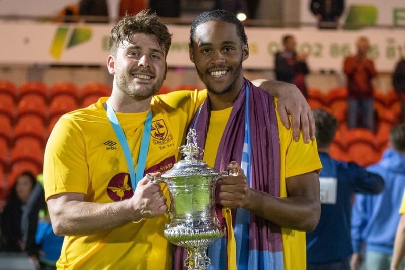 Emley players Alex Metcalfe and Iyrwah Gooden with the Sheffield & Hallamshire Senior Cup.