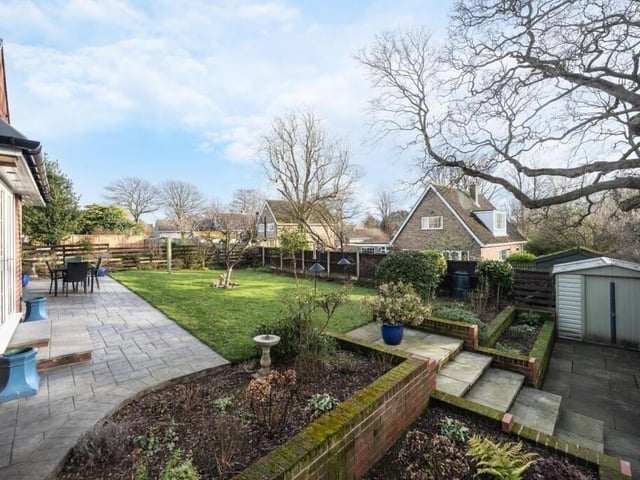 The lawned garden has views over neighbouring fields.