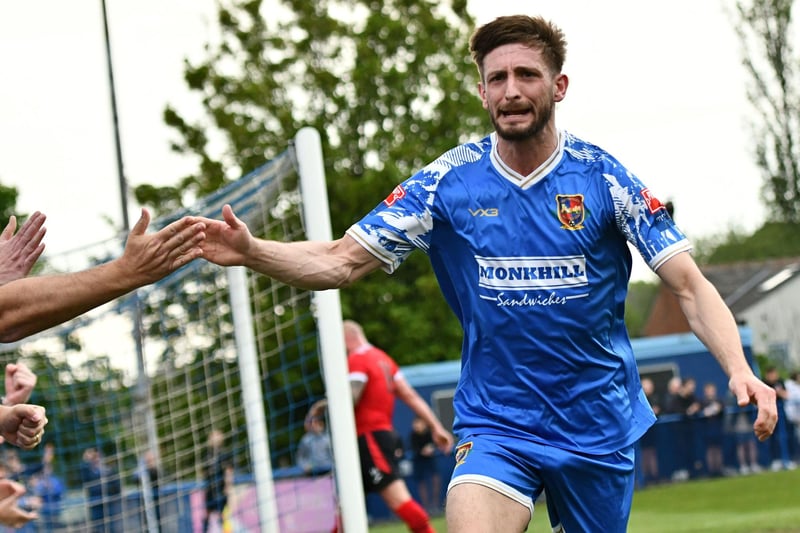 Local lad Mikey Dunn celebrates his goal in the final with fans.