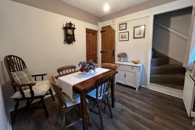 The dining room has space for a larger style suite.