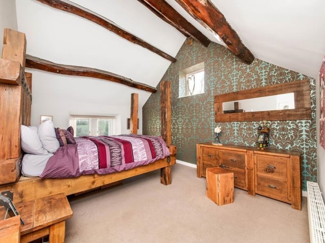 A spacious double bedroom with character.