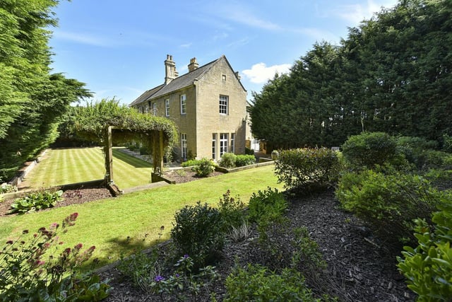 Landscaped grounds with Yorkshire stone patios and mature trees, plants and shrubs surround the Hall.