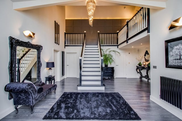The stunning entrance hallway with central staircase.