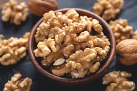 As long as you are not allergic to nuts, replace your comfort snacks with a couple of ounces of walnuts a day, to reap the health benefits. Photo: AdobeStock