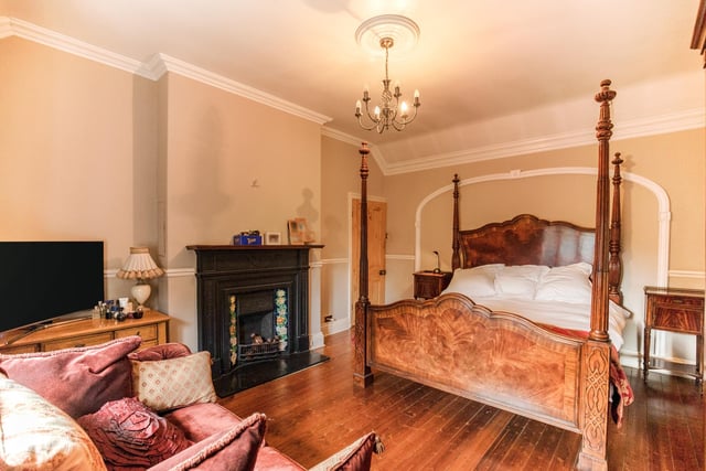 A period fireplace adds character to this bedroom within the property.