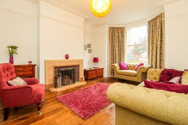 The family lounge features a central heating radiator, coving to the ceiling, ceiling rose, picture rail and, like the dining room, an art deco style gas fireplace with a tiled hearth surround and wooden mantle.