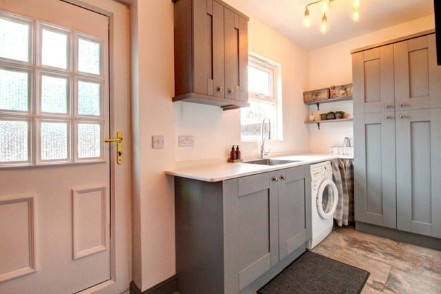 The property also features a lovely utility room with electric access to the garage.