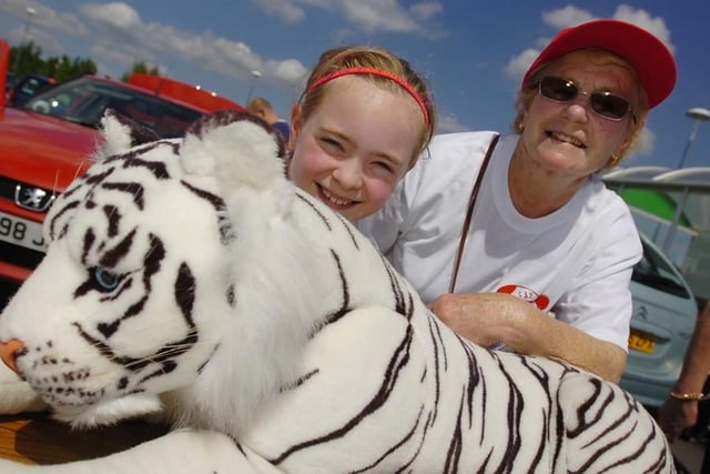 Community Awreness Project - Asda. Guess the tiger's name. Florence Booth (9) and grandma Molly Booth in 2010.