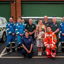 Donna Bates, with her husband John and daughter Isabella, accompanied by her team of life-savers from Yorkshire Ambulance Service, Yorkshire Air Ambulance and HM Coastguard.