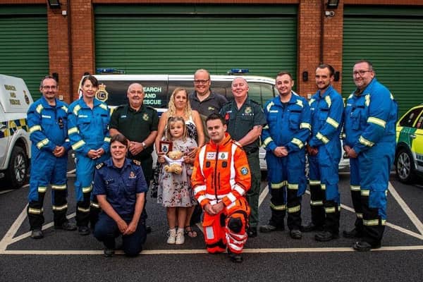 Donna Bates, with her husband John and daughter Isabella, accompanied by her team of life-savers from Yorkshire Ambulance Service, Yorkshire Air Ambulance and HM Coastguard.