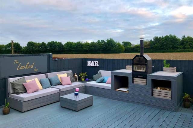 An impressive seating area with a backdrop of open fields.