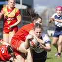 Katie Evans dives over for a try. Pictures: John Victor