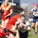 Katie Evans dives over for a try. Pictures: John Victor