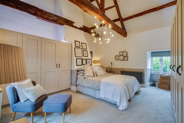 Bedroom one features windows to two sides, vaulted open ceiling with heavy wooden beams, two good ranges of bespoke excellent quality fitted wardrobes and matching cupboards.