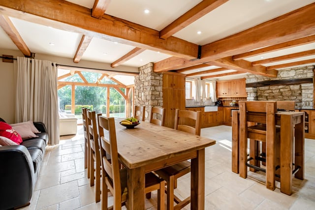 The open plan living and dining kitchen is an impressive space within the conversion and leads to the garden room.