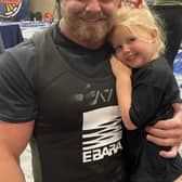 World champion Sam Hinks pictured with his four-year-old daughter.