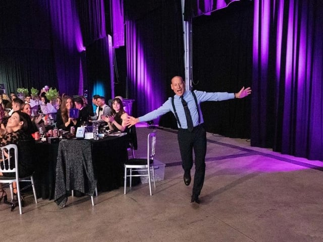 Kevin Hogarth, Retail Operations Manager at The Prince of Wales Hospice, taking to the stage for his award.
