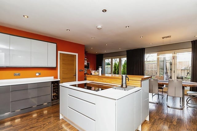 The high spec, open plan living kitchen has tri-fold doors tot he gardens.