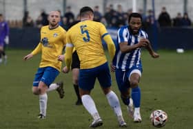 Alhassane Keita on the attack for Frickley Athletic as he takes on Hemsworth MW centre-half Charlie Barks. Picture: Scott Merrylees
