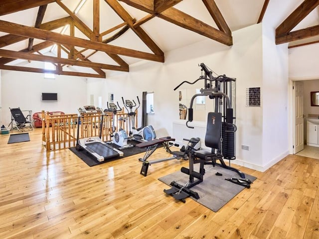 Also on the top floor of the annexe is a shower room and a studio gym that began life as a chicken coop barn.