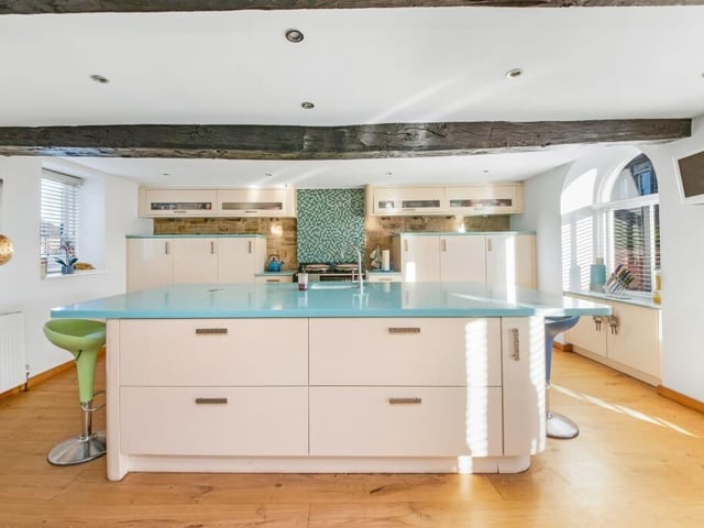 The swish living kitchen is light, bright and spacious.